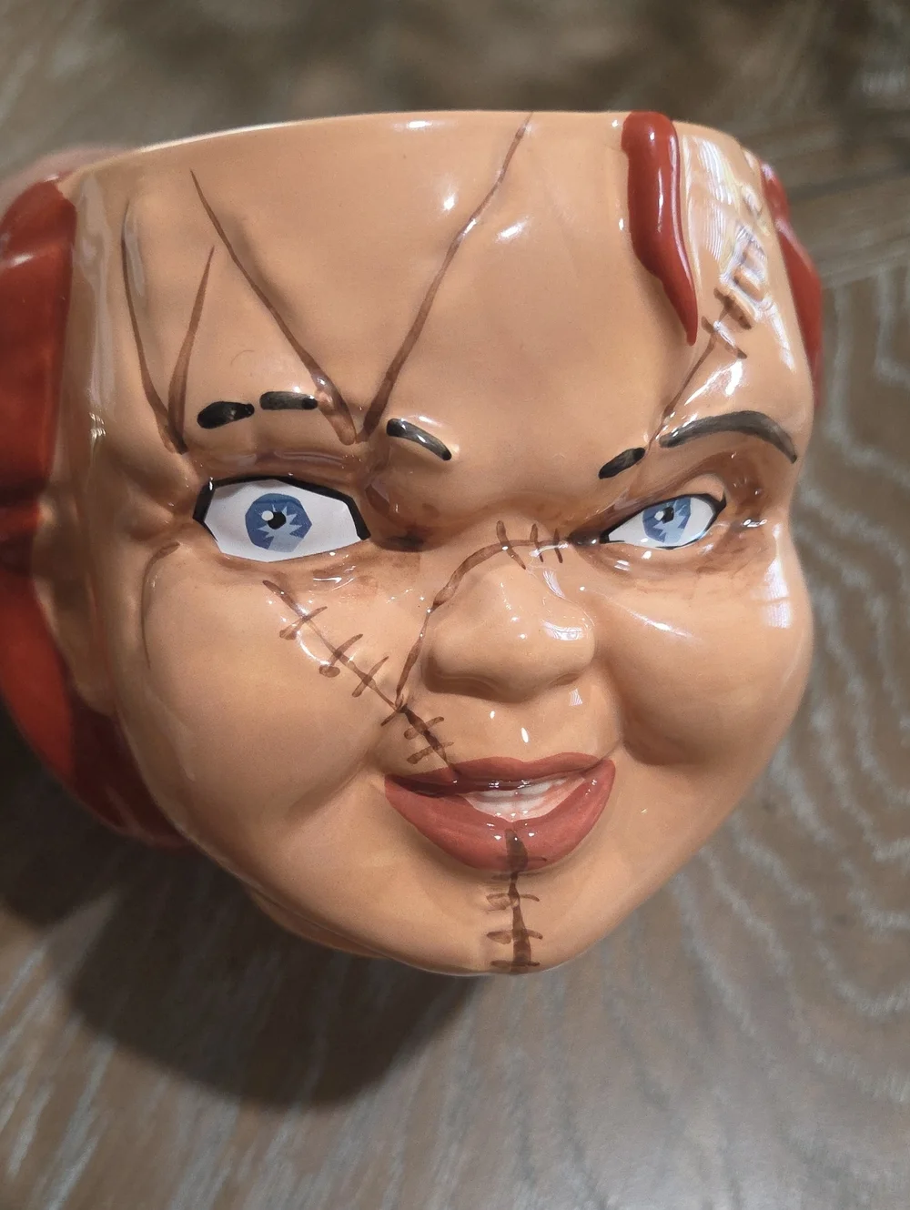 Novelty Horror Doll Face Ceramic Mug in Brown and Red -